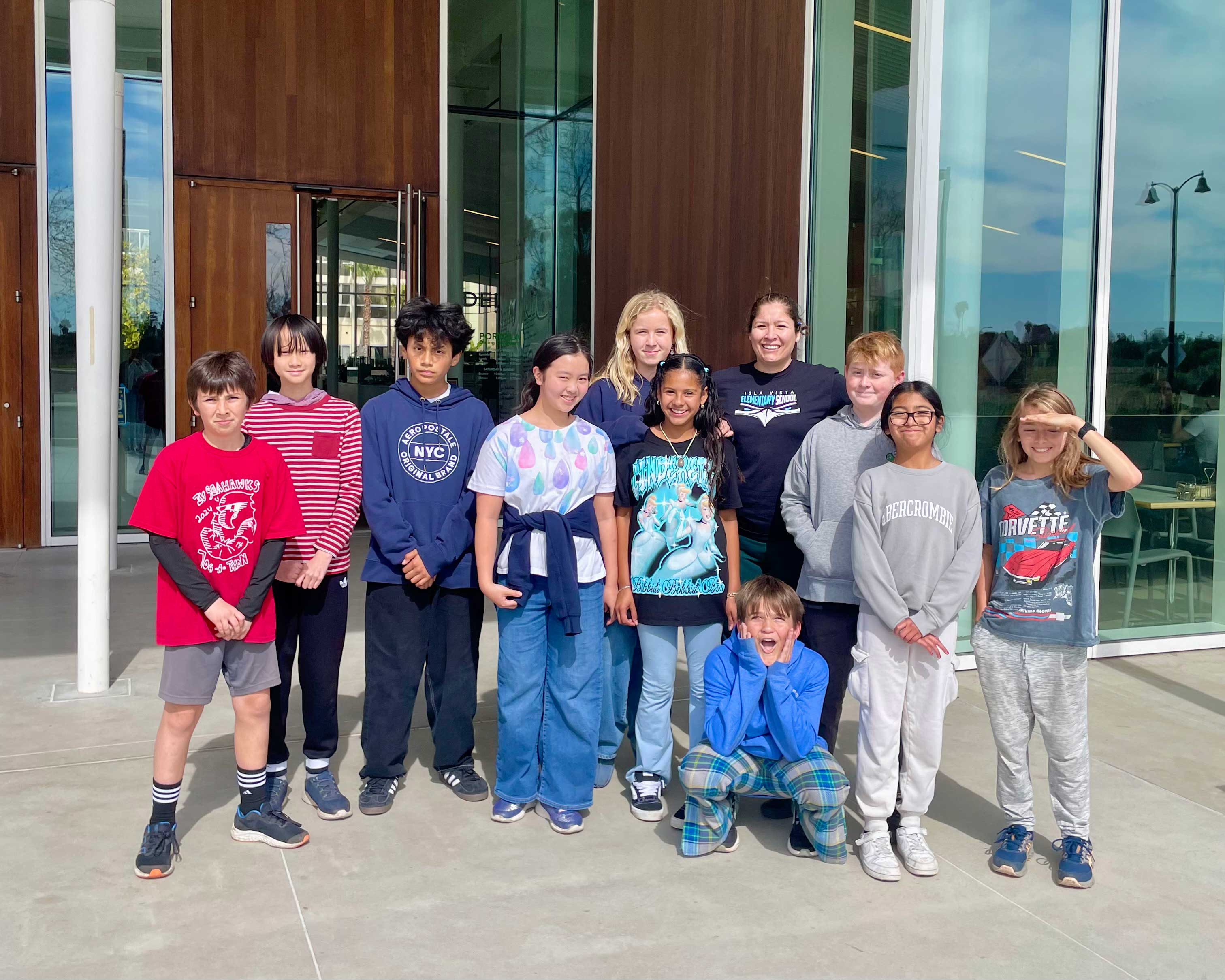 A group of sixth graders inside a large, open dining commons