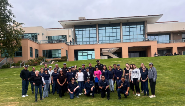 Staff members gathered on grass