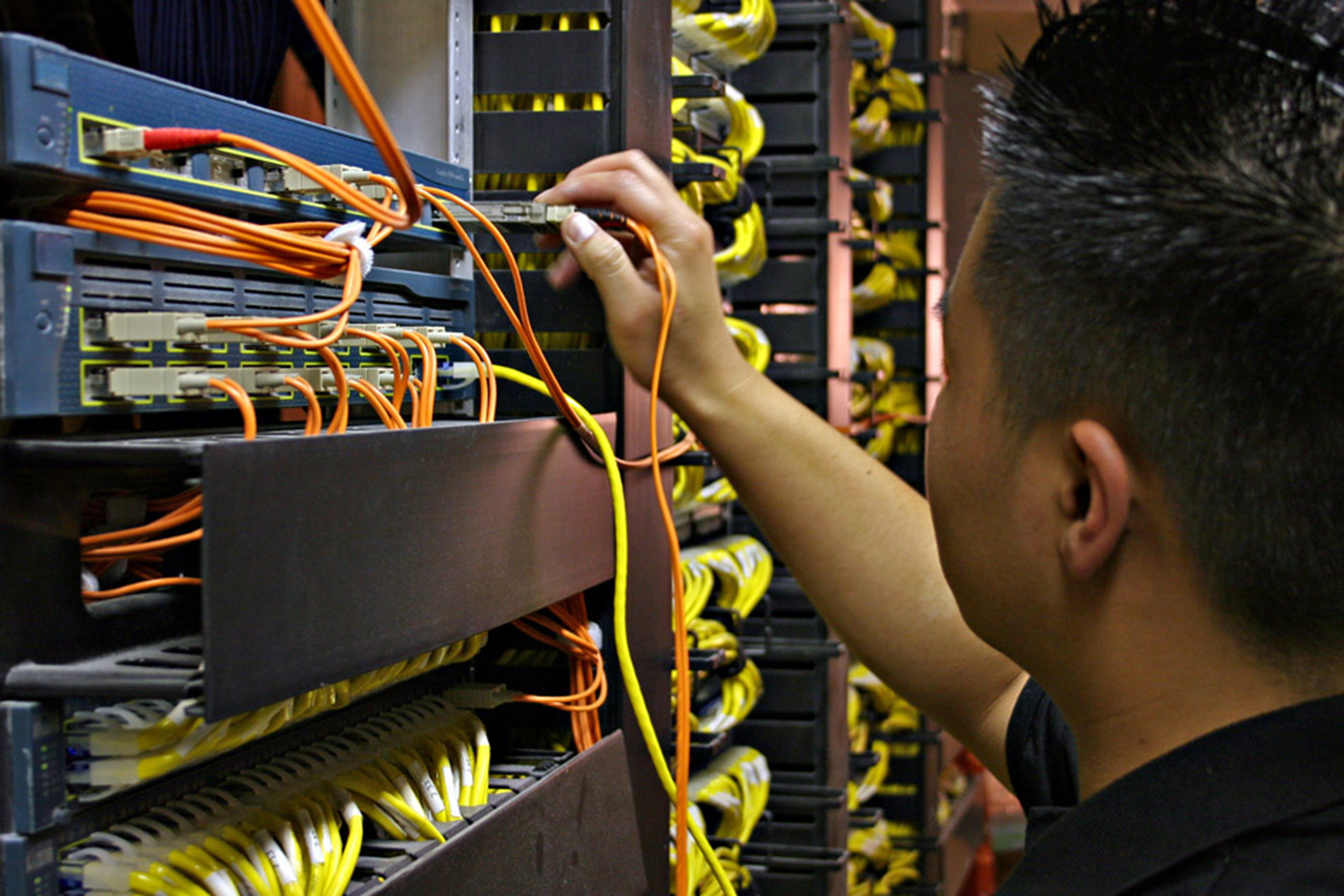 technician checking server room 