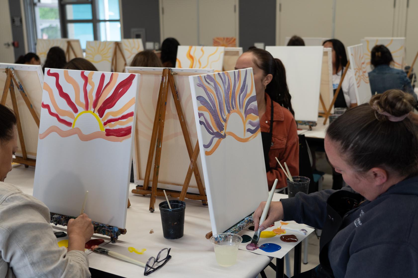 artists painting on canvas