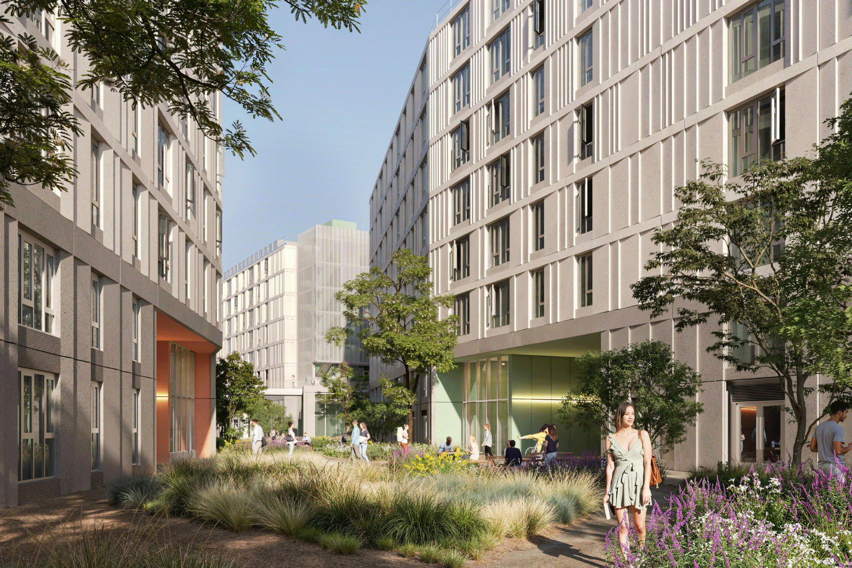 Students enjoying outdoor space between buildings.