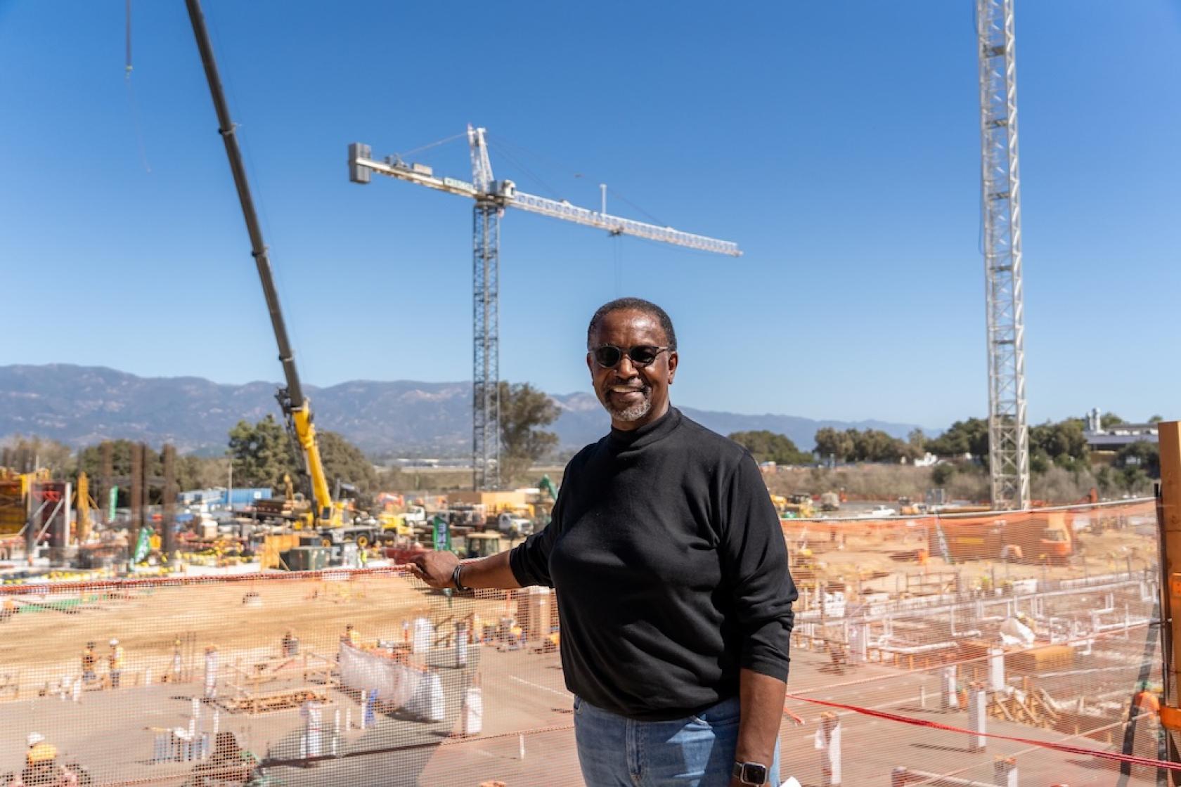 Man stands in front of construction site