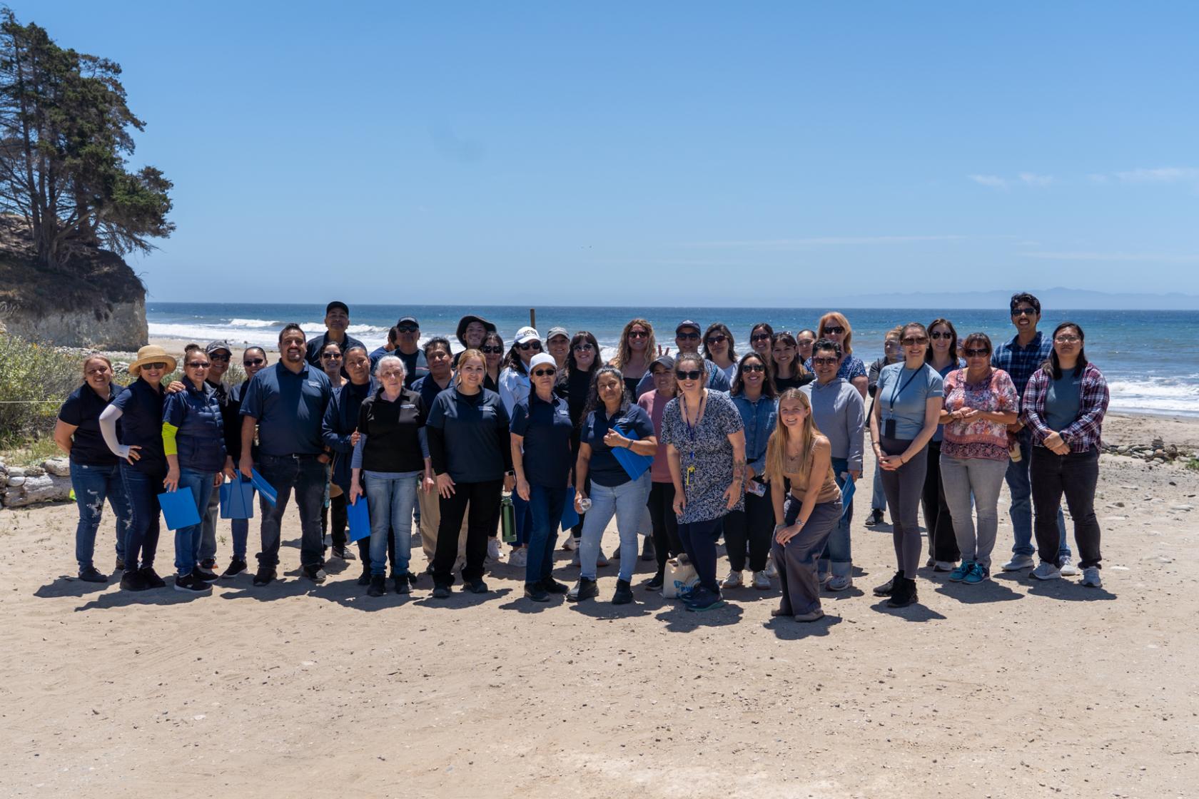 group of staff on the beach